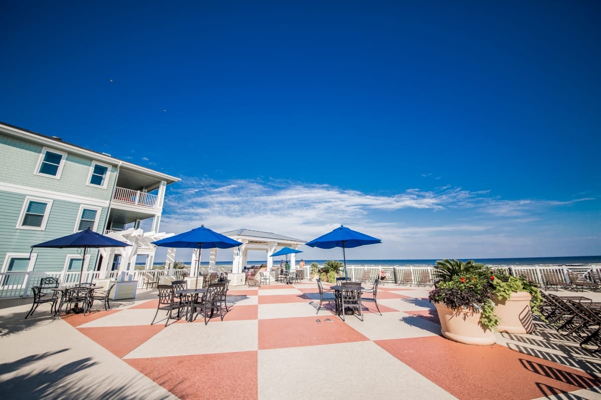 Poolside patio with umbrellas