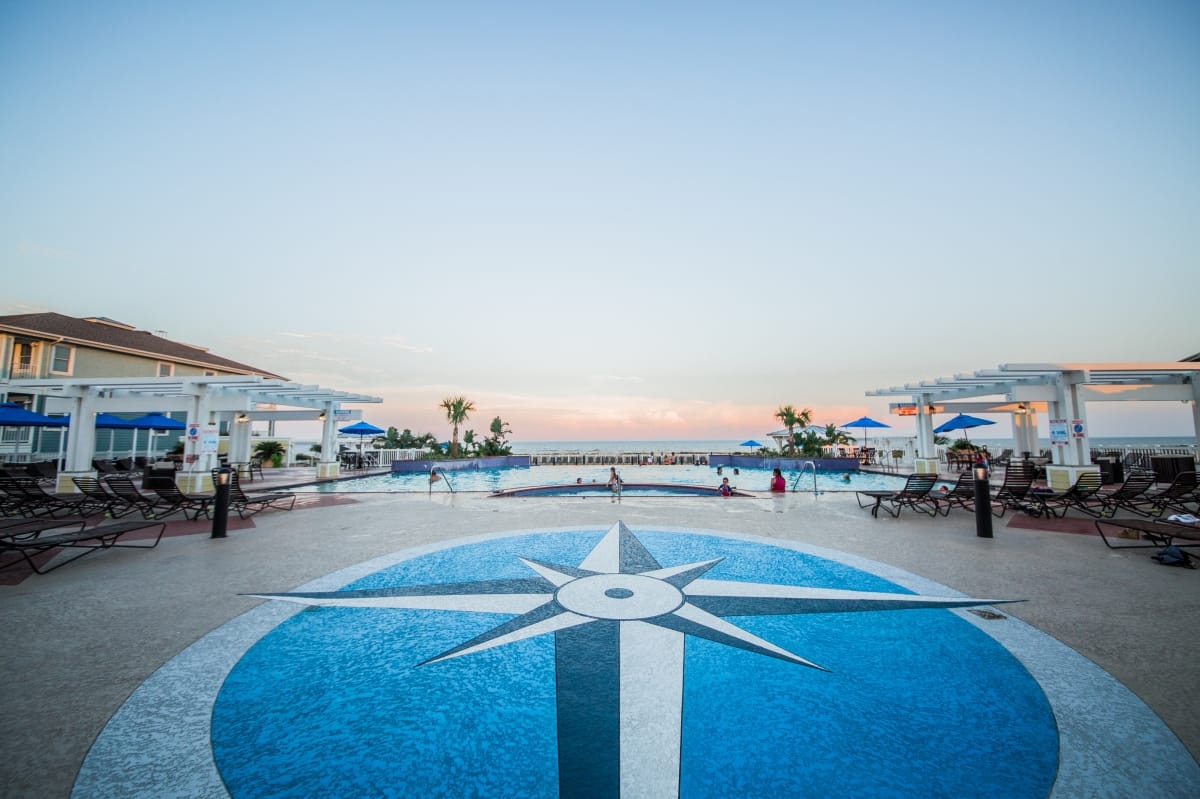 Compass-rose resort pool at dusk
