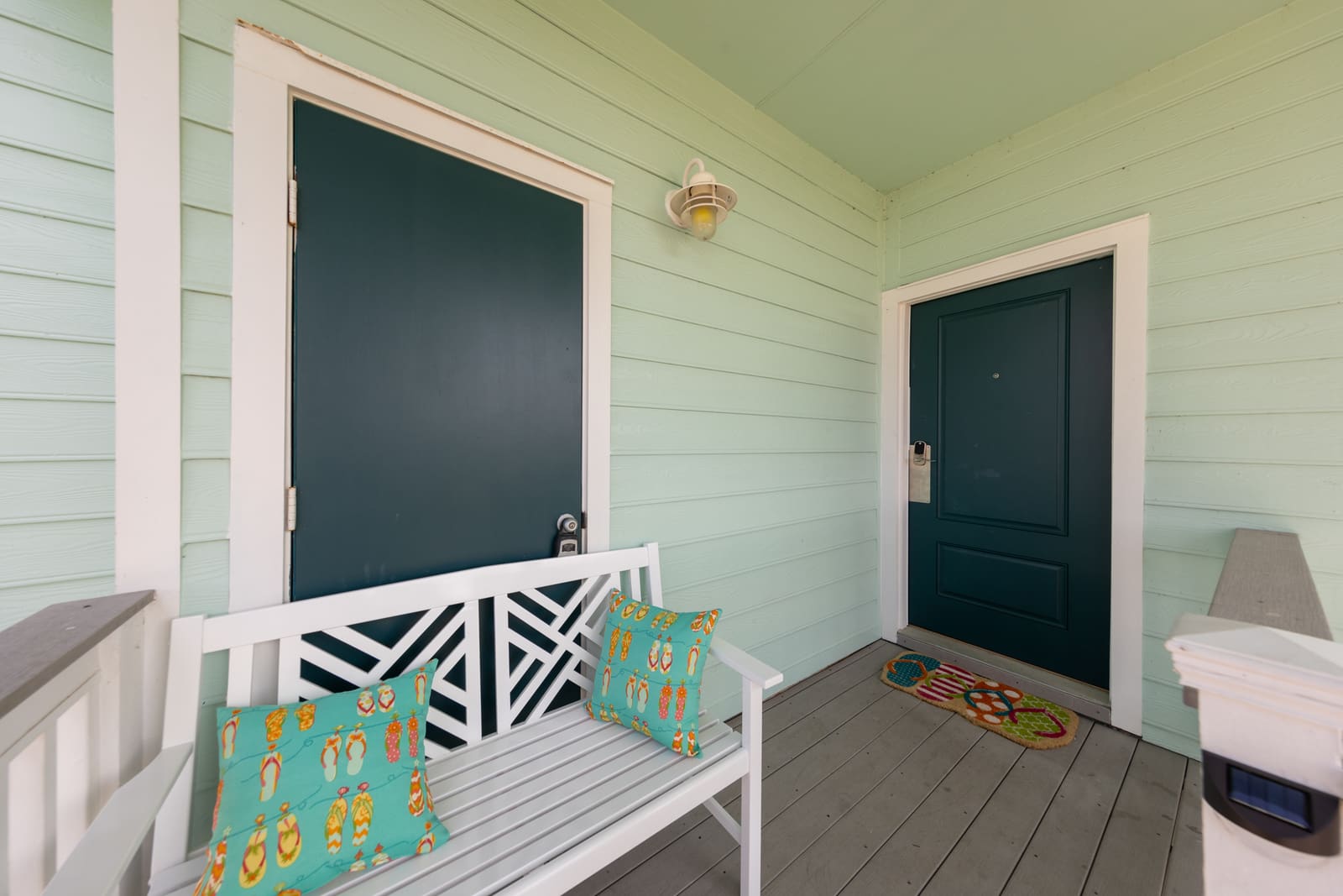A welcoming beach house entrance at sunset