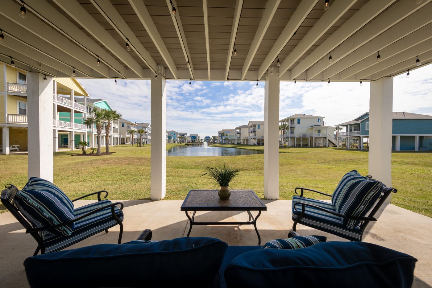 Ground-level covered patio with lounge seating