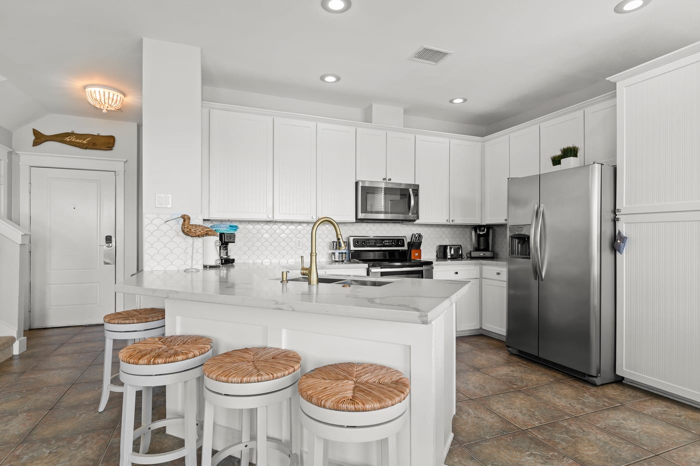 Fully equipped gourmet kitchen with stainless appliances