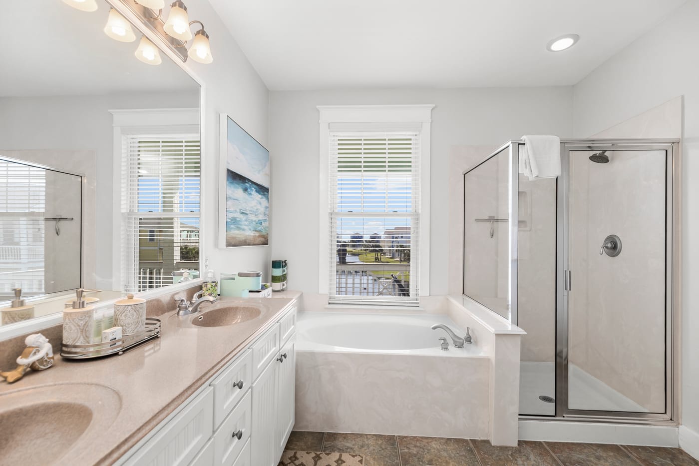 Spa-style primary bathroom with soaking tub and walk-in shower